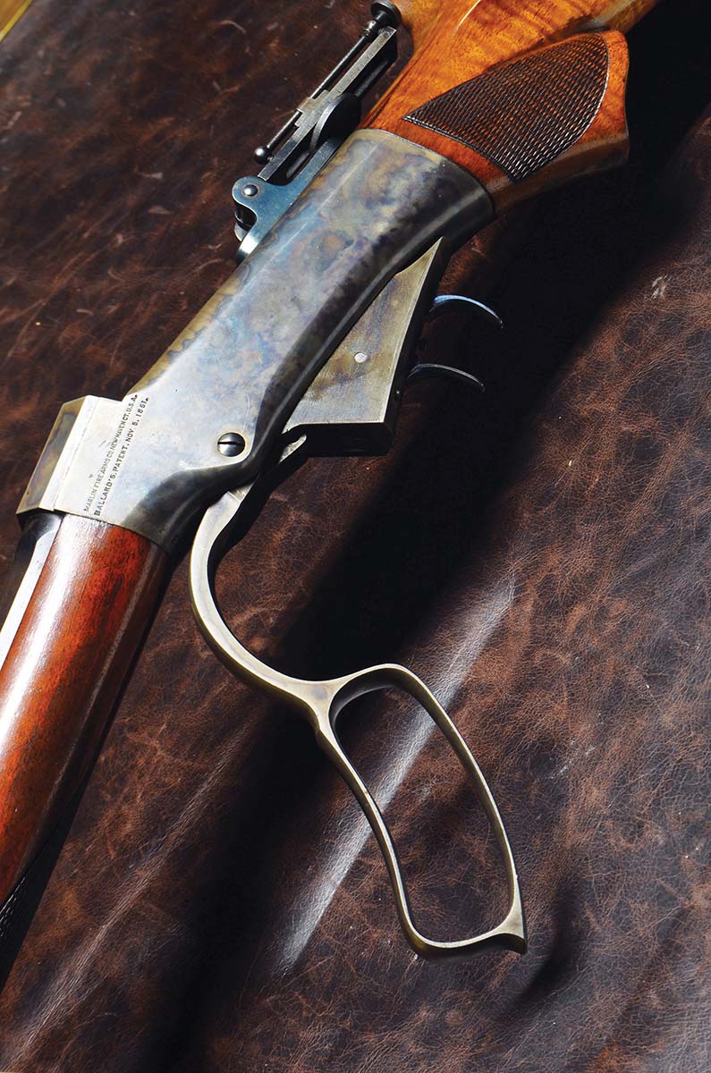 When the Ballard action is open, the breechblock falls away from the breech and moves slightly to the rear as the action opens. The cartridge does not need to be completely seated for the action to close. A chamfer on the top of the breechblock will cam the cartridge into the chamber.